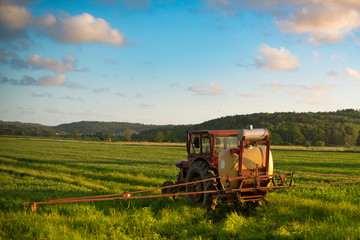 Fototapeta premium combine harvester working on wheat field