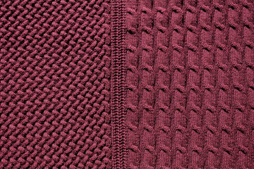 Repeating Machine Knitting Texture of Sweater. Dark red Knitted Background.