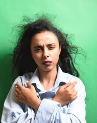 Young african woman wearing shirt over on colorful wood background thinking looking tired and bored with depression problems