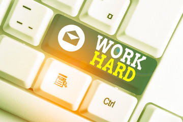 Word writing text Work Hard. Business photo showcasing Laboring that puts effort into doing and...