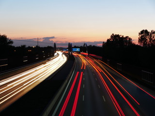 Fototapeta na wymiar Long exposure image of the German Autobahn A8 near Augsburg during sunset