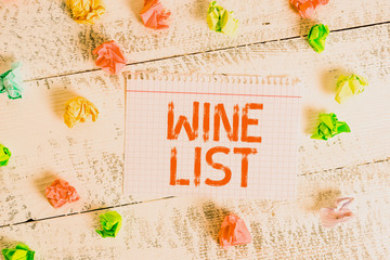 Handwriting text writing Wine List. Conceptual photo menu of wine selections for purchase typically in a restaurant Crumpled colored rectangle square shaped paper reminder white wood desk
