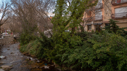Beautiful snowy landscape of Guadarrama mountains in a small medieval town of Rascafria near the Spanish capital Madrid in winter. Famous touristic attraction for winter sports, leisure in Spain