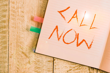 Writing note showing Call Now. Business concept for To immediately contact a demonstrating using...