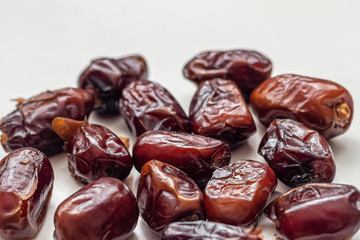 Macro photography of dried dates, with wrinkled brown skin