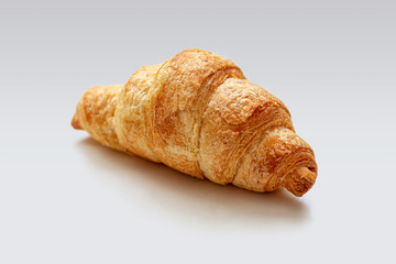 Fresh mini croissant with a Golden crust on a white background