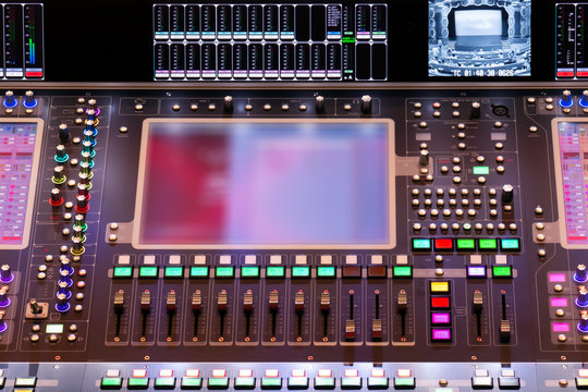 Director console with copy space. Controlling panel with numerous illuminated control element, that is used at concerts and other shows with empty screen for your image or copy space.