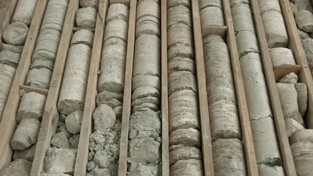 Rock core samples from drilled borehole in wooden box