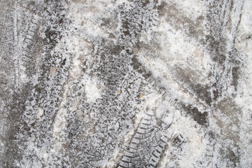 Ice with tire and shoe tread marks