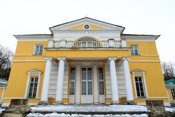 Old Russian estate in yellow in winter