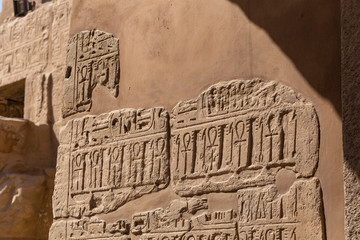 Karnak Temple, complex of Amun-Re. Embossed hieroglyphics on walls. Luxor Governorate, Egypt. Ankh...