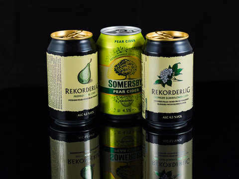 Heidelberg, germany - december 10, 2015 - cans of cider isolated on black