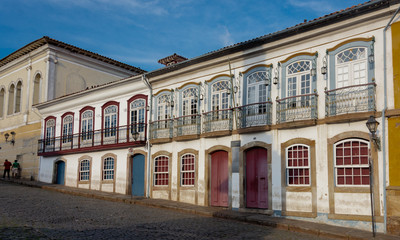 Fototapeta na wymiar Colorful colonial buildings in Tiradentes square in Ouro Preto, Brazil.