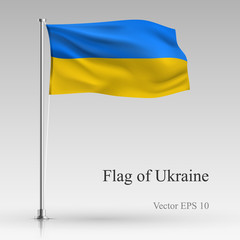National flag of Ukraine isolated on gray background. Realistic Ukrainian flag waving in the Wind. Wavy flag of Ukraine Vector illustration.