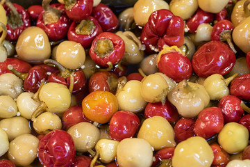 Pickled peppers close-up. In red and white color.