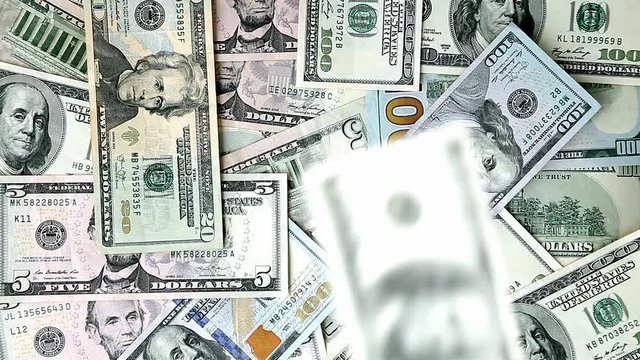 background from scattered dollar banknotes as abstract seamless