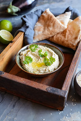 Delicious eggplant dip Baba Ganoush topped with sesame seeds and olive oil