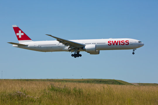 Chicago, USA - July 12, 2018: Swiss airline Boeing 777 on final approach to O'Hare International Airport. Swiss is the national airline of Switzerland.