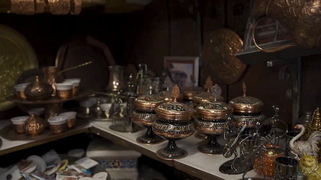 Sarajevo street bazaars with delight cups, pots, tea kettles and souvenirs made of copper. Traditional Sarajevo antique shop made by Coppersmith. Bascarsija is most popular traveling destination