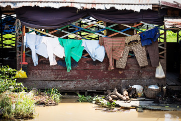 Laundry on a wooden floating house at Tonle Sap Lake in Puok, Siem Reap Province, Cambodia