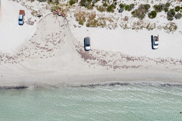 Overhead view of 3 cars at Esperance beach in Western Australia