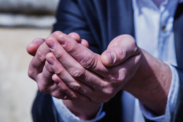 Bankruptcy and poverty  concept. Close up businessman in a suit begging for help and asks for money.