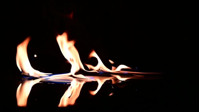 Burning fire. Bonfire. Close Up of fire flames burning slow motion effect background footage motion graphics, or as a background or overlay.