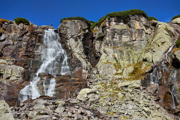 Beautiful waterfall in the High Tatras mountain in Slovakia - The Skok waterfall © andras_csontos