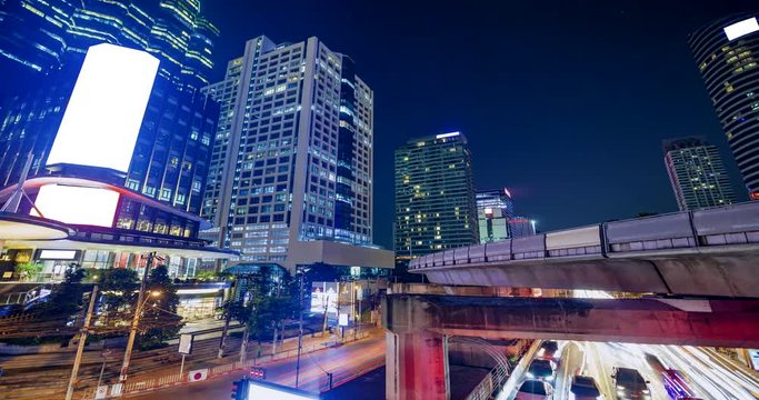 4K timelapes night of bangkok, at skytrain station Chong Nonsi skywalk (BTS) on the Silom Line, Concept of business city.