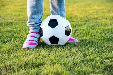 female soccer. Legs on the football field. 