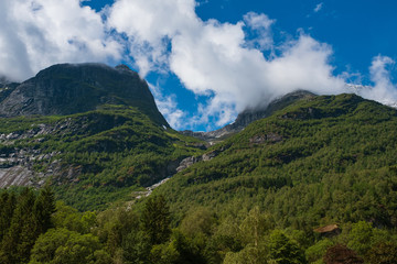 Naklejka premium Mountains over the beautiful lake Oldevatnent in Stryn, Norway. July 2019