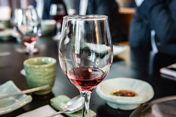 glass of red wine on table in restaurant