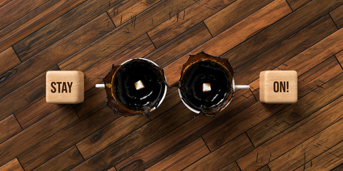 cups of coffee and cubes with text STAY ON on wooden background