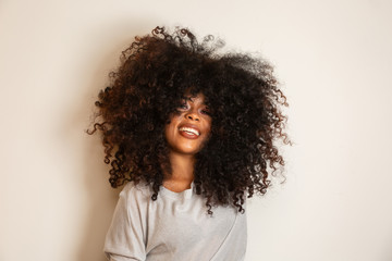 Beauty portrait of african american woman with afro hairstyle and glamour makeup. Brazilian woman....