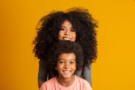 Mother And Son With Black Power Style Hair.