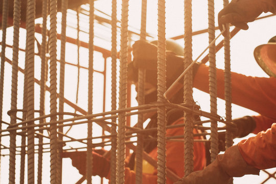 The worker steel binding wire by use wire tie twisting tool a necessary tool for tying bag and rebar.