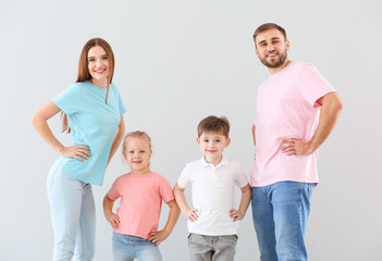 Portrait of happy family on light background