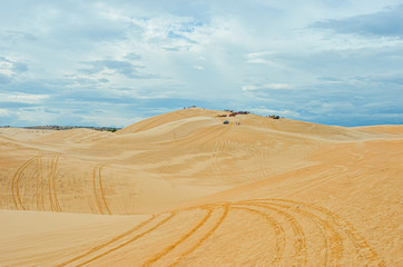 Fototapeta na wymiar desert at white sand dunes mui ne with blue sky in vietnam
