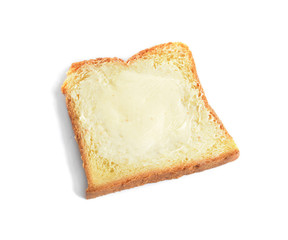 Slice of bread with butter on white background
