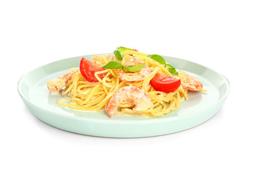 Plate with tasty pasta and shrimps on white background