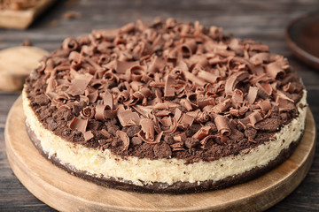 Tasty chocolate cheesecake on table, closeup