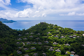 Aerial view of tropical island of Mahe Seychelles and luxury accommodation villas  