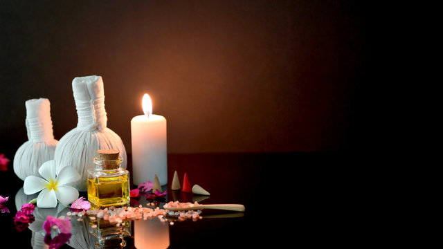 Cropped shot of spa treatment and relax concept with spa accessories,   candle and aroma oil