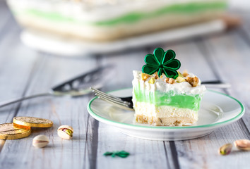 A serving of pistachio pudding and whip cream layered dessert for Saint Patrick's Day.