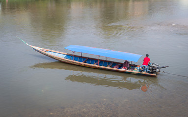 Wooden boat on the river, travel by boat, transportation by water, outdoor day light, travel in Asia