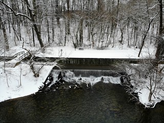 The aerial view of the waterfall in Brandywine Park after a snowstorm in Wilmington, Delaware, U.S.A