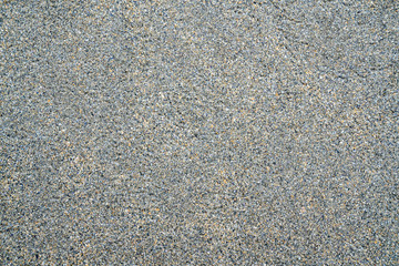 Sand background on the shore of ocean
