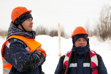 Two workers at the site of the ice camp