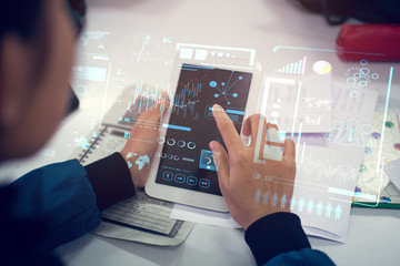 business woman hand working on blank screen laptop computer on wooden desk as concept with social media diagram