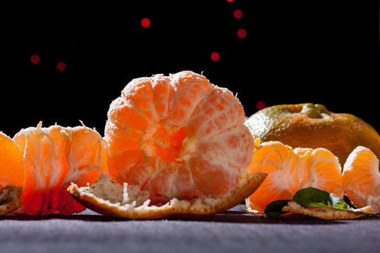 orange tangerine ,citrus reticula on table black background back light. mandarin variety orange hybrids contain pomelo.still life